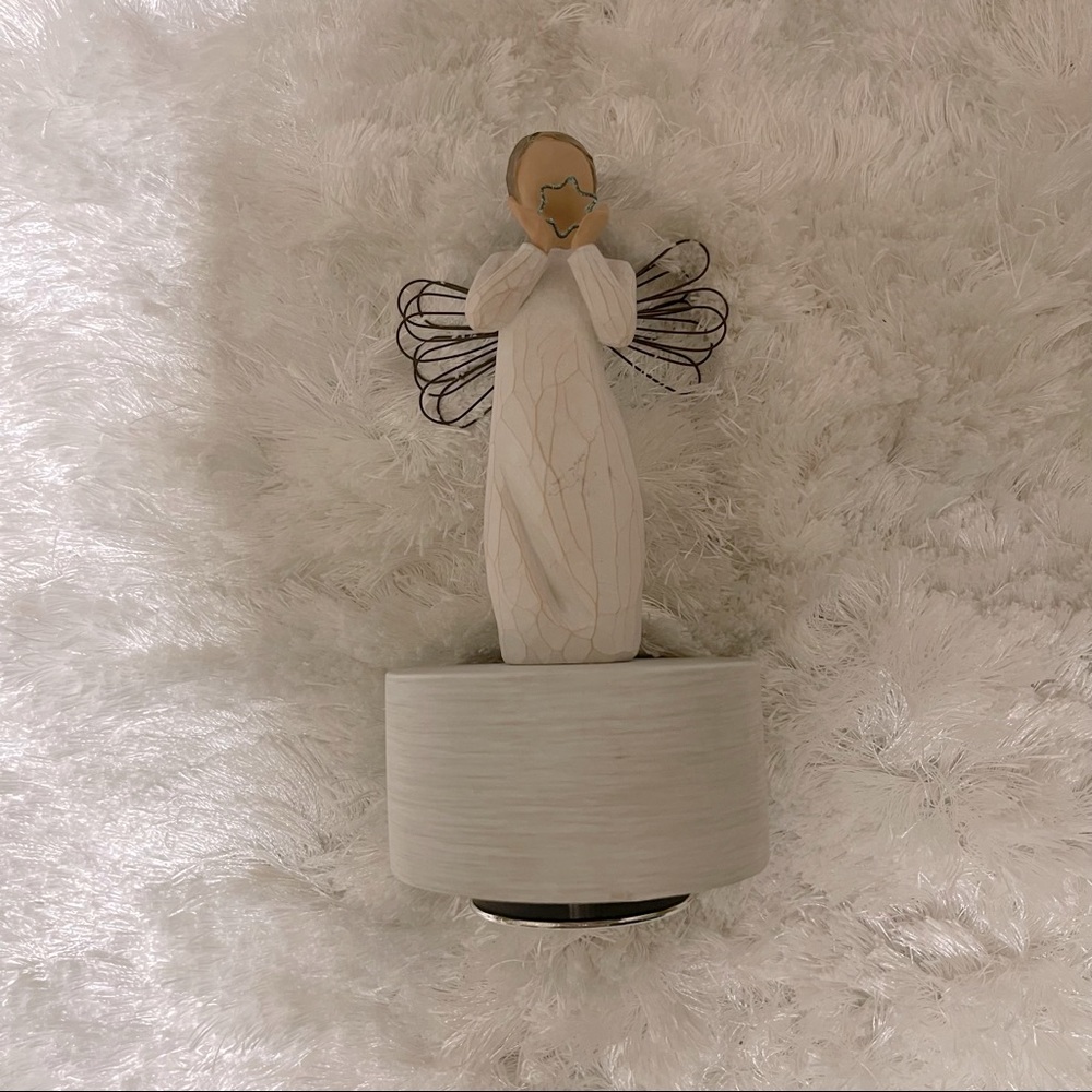 Musical angel figurine. Plays German carol; “O Du Frohliche.” Like New